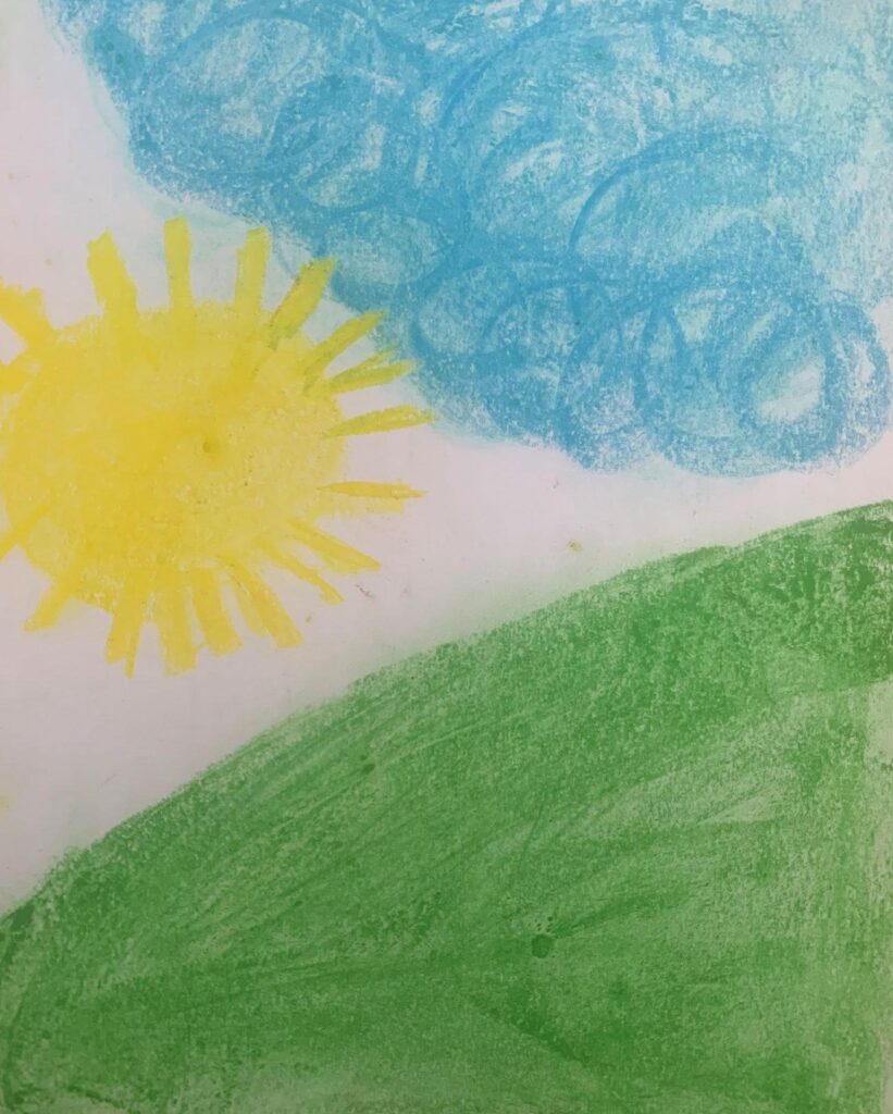 Coloured drawing of a green hill, blue clouds and big yellow sun